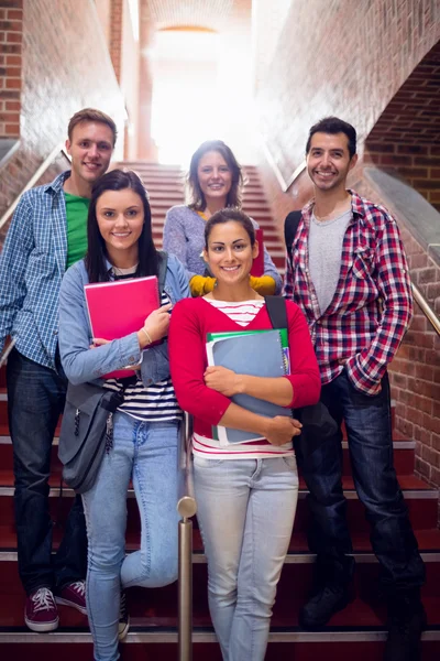 College students standing on stairs in college — Stockfoto