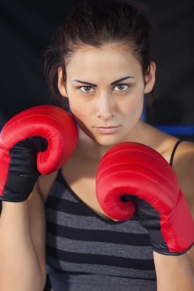 Close-up of a beautiful woman in red boxing gloves — Stock Photo, Image