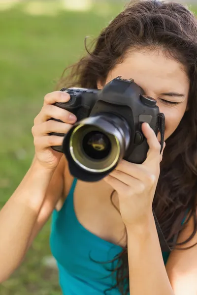 Gorgeous peaceful woman using her camera — Stock Photo, Image