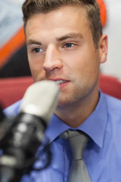 Well dressed concentrating radio host moderating — Stock Photo, Image