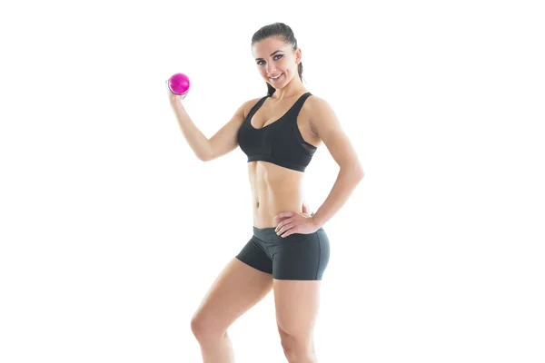 Sportovní kondici žena pózuje s růžovou ručičku váhy — Stock fotografie