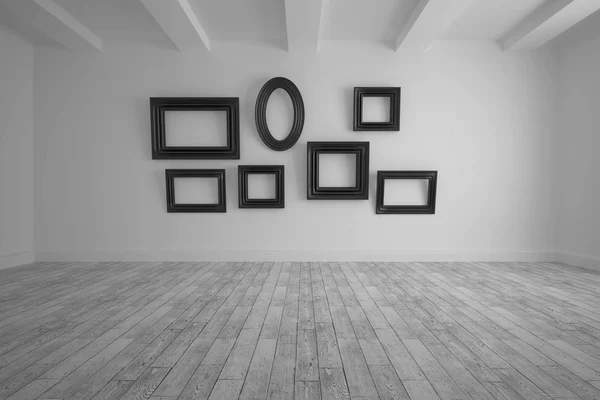 Big room with several frames at wall — Stock Photo, Image