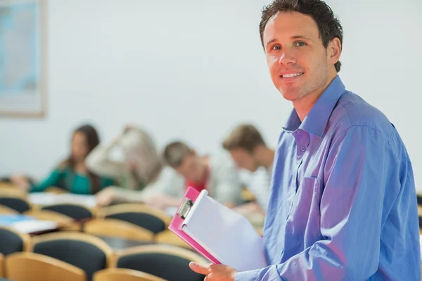 Teacher with young college students in the classroom — Stock Photo, Image