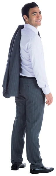 Улыбающийся бизнесмен стоит — стоковое фото