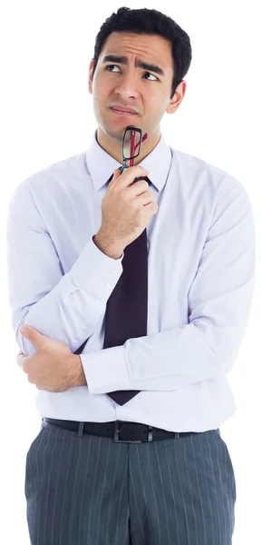 Thinking businessman holding glasses — Stock Photo, Image