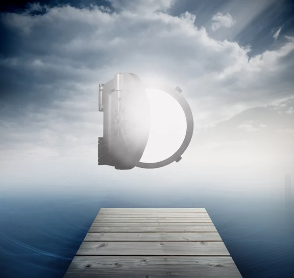 Shiny open safe in sky over ocean — Stock Photo, Image
