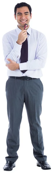 Smiling businessman holding glasses — Stock Photo, Image