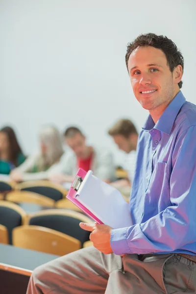 Teacher with young college students in the classroom — Stock Photo, Image