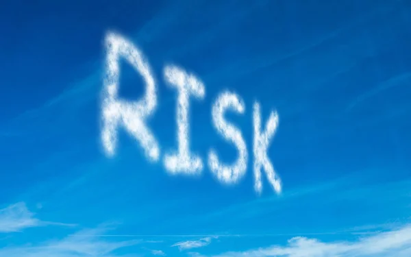 Risk written in white in sky — Stock Photo, Image