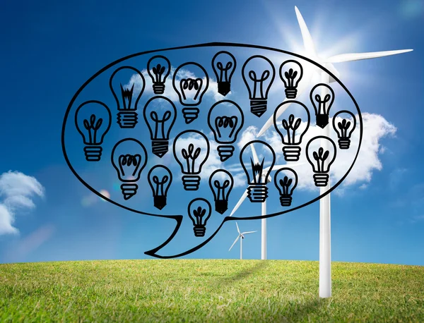 Light bulbs graphic on bright countryside with wind turbines — Stock Photo, Image