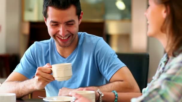 Student couple chatting together in the canteen — Stock Video