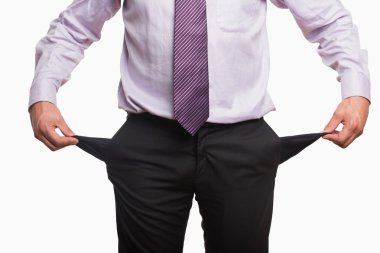 Mid section of a businessman with pockets pulled out clipart