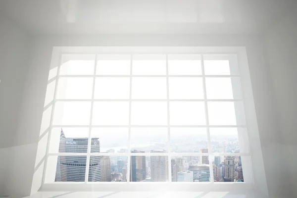 Room with large window showing city — Stock Photo, Image