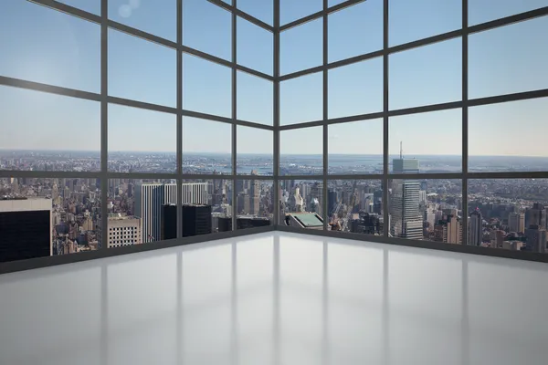 Room with large window showing city — Stock Photo, Image