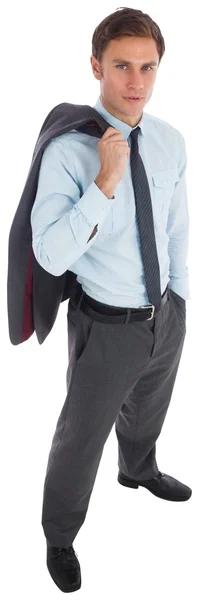 Hombre de negocios serio sosteniendo su chaqueta — Foto de Stock