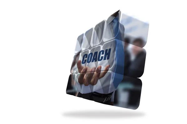 Businessman holding coach text on abstract screen — Stock Photo, Image