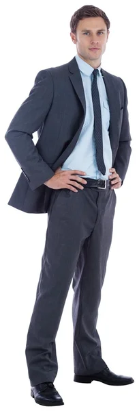 Serious businessman with hands on hips — Stock Photo, Image