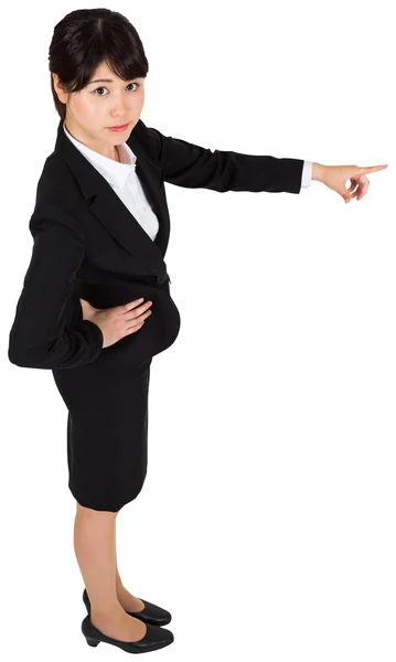 Focused businesswoman pointing — Stock Photo, Image