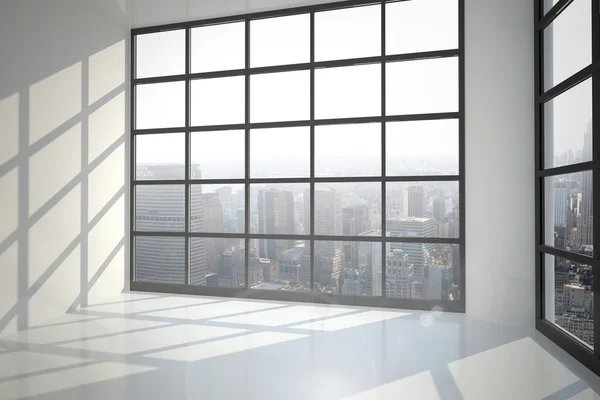 Room with large window showing city — Stock Photo, Image