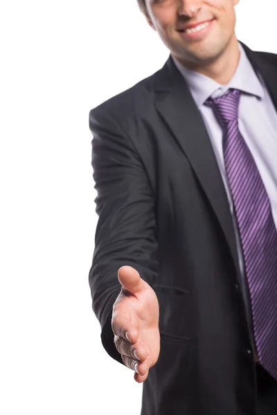Mitten delen av affärsmannen erbjuder ett handslag — Stockfoto