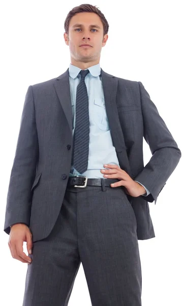 Stern businessman with hand on hip — Stock Photo, Image