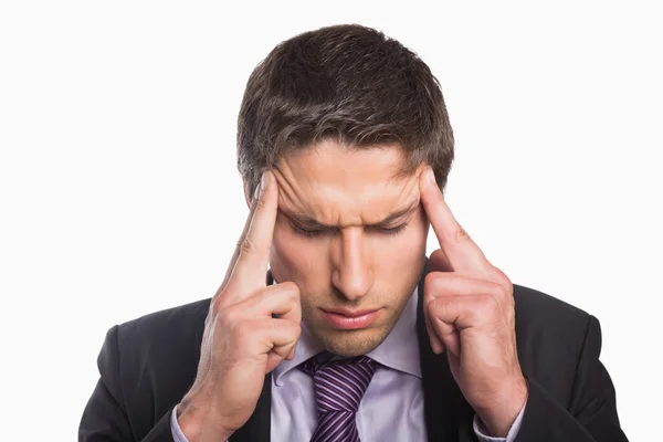 Tensed businessman suffering from headache — Stock Photo, Image