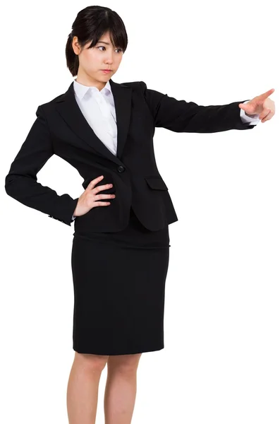 Focused businesswoman pointing — Stock Photo, Image