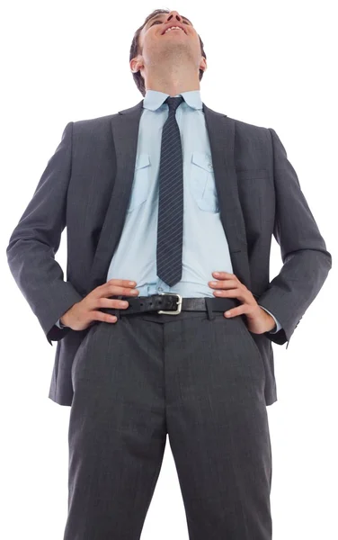 Hombre de negocios feliz con las manos en las caderas — Foto de Stock