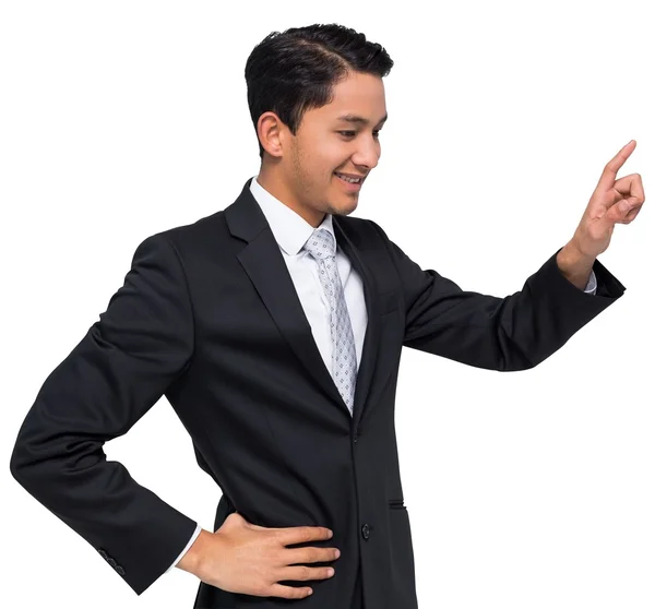 指している笑顔のアジア系のビジネスマン — ストック写真