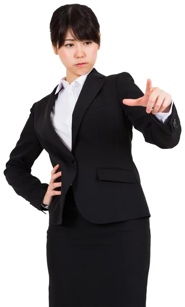 Focused businesswoman pointing — Stock Photo, Image