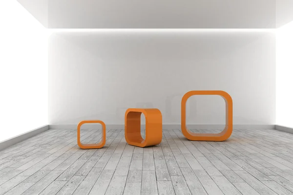 Оранжевые конструкции в серой комнате — стоковое фото