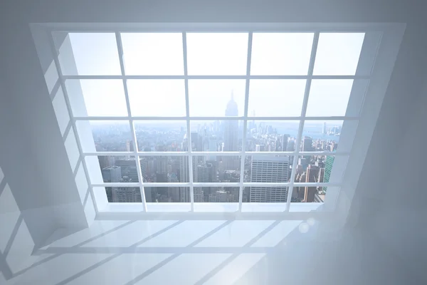 Room with large window showing city — Stock Photo, Image