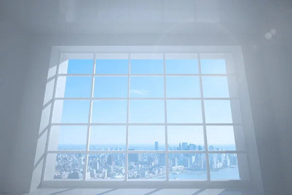 Room with large window showing city — Stock Photo, Image