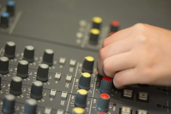 Hand working on a sound mixing desk — Stock Photo, Image