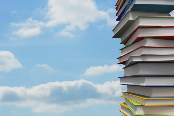 Pile of books against sky — Stock Photo, Image