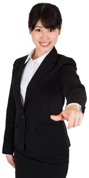 Smiling businesswoman pointing — Stock Photo, Image