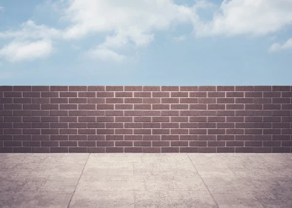 Blue sky over a brick wall — Stock Photo, Image