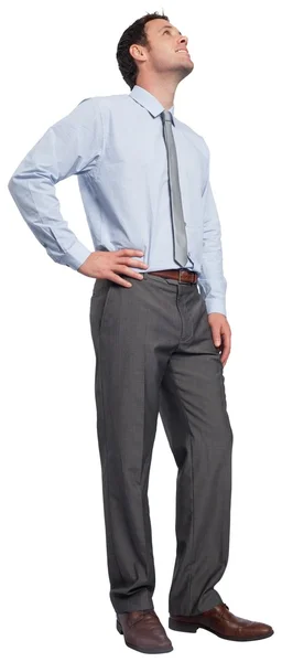 Smiling businessman with hand on hip — Stock Photo, Image