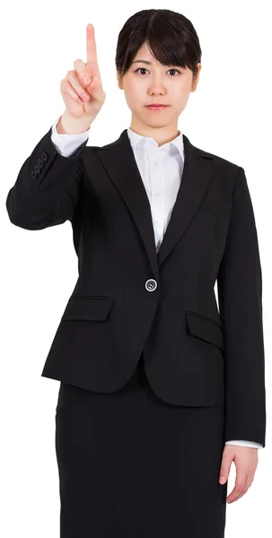 Focused businesswoman pointing — Stock Photo, Image