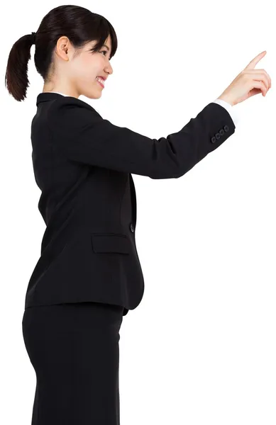 Smiling businesswoman pointing — Stock Photo, Image