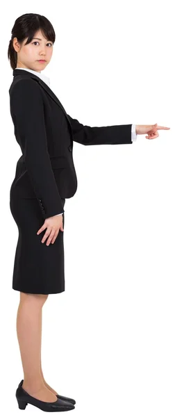 Focused businesswoman pointing — Stock Photo, Image