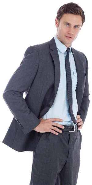 Serious businessman with hands on hips — Stock Photo, Image