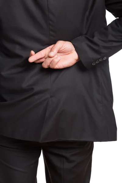 Mid section of a businessman with crossed fingers — Stock Photo, Image