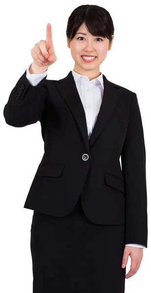 Smiling businesswoman pointing — Stock Photo, Image