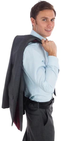 Улыбающийся бизнесмен держит куртку — стоковое фото