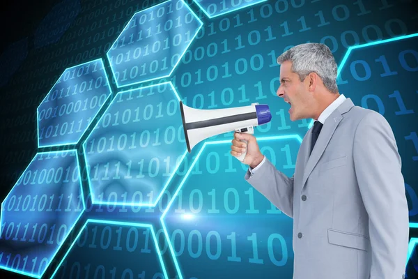 Businessman shouting in loudspeaker — Stock Photo, Image