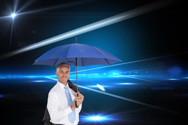 Businessman holding umbrella — Stock Photo, Image