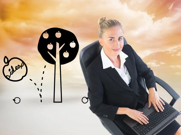 Composite image of businesswoman sitting on swivel chair with laptop — Stock Photo, Image