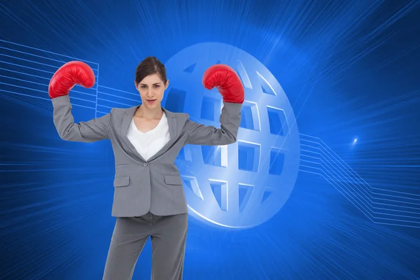 Composite image of businesswoman with boxing gloves — Stock Photo, Image