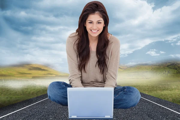 Woman smiling with laptop — Stock Photo, Image